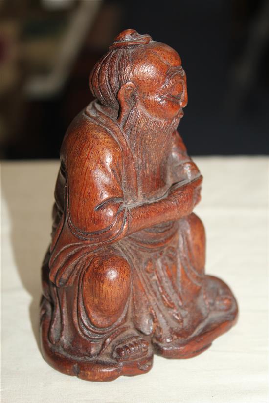 A Chinese bamboo seated figure of an immortal, 13.5cm